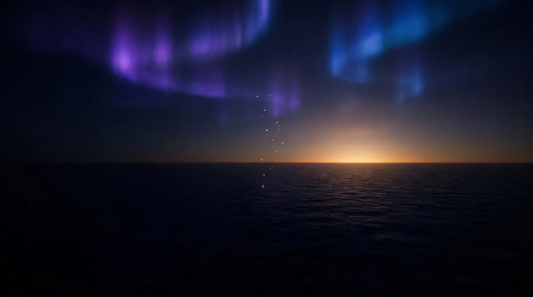 Amanecer dorado sobre el océano mientras se desvanece la aurora